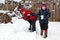 Two boys playing in the snow