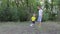 Two boys playing with soccer ball in the park