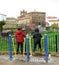 Two boys playing on a walking or balancing gymnastic apparatus