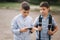 Two boys plays online games in quarantine. Young boys smile and use phone