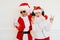 Two boys pretending he is a Bad Santa