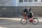 Two boys ride bicycles on paved road. Children ride on Bicycle who is faster