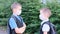 Two boys, schoolchildren in white medical masks on their faces talking to each other, brothers or friends, the concept of studying