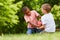 Two boys scuffle for soccer ball