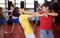 Two boys in sparring practice self defense technique in gym