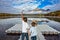 Two boys stand on the plastic dock