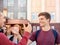 Two boys students greeting each other near campus