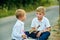 Two boys are talking together to play