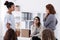 Two brave women standing and looking at each other during role paying at psychotherapy support meeting