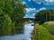 Two bridges on a quiet, rural section of the Leeds to Liverpool Canal in Lancashire, UK.