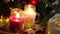 Two bright beautiful burning Christmas candles in glass jars