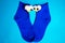 Two bright blue socks with funny eyes on a blue background. Puppet theatre. View from above.