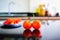 Two bright red tomatoes are placed on the kitchen counter