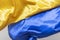 Two bright satin two-tone fabrics floating in the wind with the colors of the Ukrainian flag