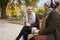 Two British Muslim Women Eating Lunch In Park Together