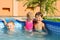 Two brothers and baby sister in the pool