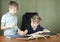 Two brothers doing homework at the desk