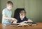 Two brothers doing homework at the desk