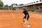 Two brothers playing friendly tennis match on the court