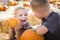 Two Brothers at the Pumpkin Patch Talking and Having Fun