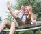 The two brothers are resting and having fun .Children ride in a hammock.	ï¿¼