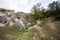 Two brothers wear backpack explore limestone stone caves at mountain in Pidkamin, Ukraine