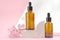 Two brown bottles with a dropper with essential oils or serum with hyacinth flowers. Care and beauty concept