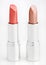 Two brown lipsticks isolated over white