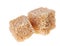 Two brown lump cane sugar cubes, isolated