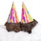 Two brown puppies in party hats