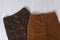 Two brown skirts on a wooden background. Fashion concept