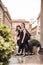Two brunette girls dressed in black strolling through the city of Milan, Italy