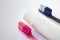 Two brushes pink and blue with toothpaste tube mockup