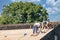 Two builders busy with reparing roof of wooden shed