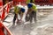 Two Builders Cutting Concrete Wet Cutting