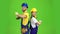 Two builders stand back to back and point with their fingers straight. Green screen