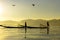 Two Burmese men paddle their legs Came out to find fish in the morning on Inle Lake