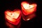 Two burning candle hearts