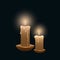 two burning candles on a black background