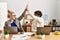 Two business executives raised up hands hitting five at the office