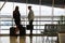 Two business women on business trip in the airport