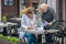 Two business women in an outdoor cafe closed the deal and sign t