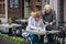 Two business women in an outdoor cafe closed the deal and sign t