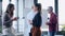 Two business young woman drinking coffee while taking a break on coworking space