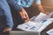 Two businessman planning strategy on desk with paperwork, Strategist team analyze data or information