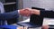 Two Businessman signing contract document start business agreement dealing teamwork. Close up hand young man colleagues  meeting m