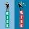 Two businessman standing on risk blocks