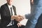 Two businessmen doing handshake after deal negotiation complete
