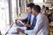 Two Businessmen Having Informal Meeting In Coffee Shop