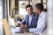 Two Businessmen Having Informal Meeting In Coffee Shop